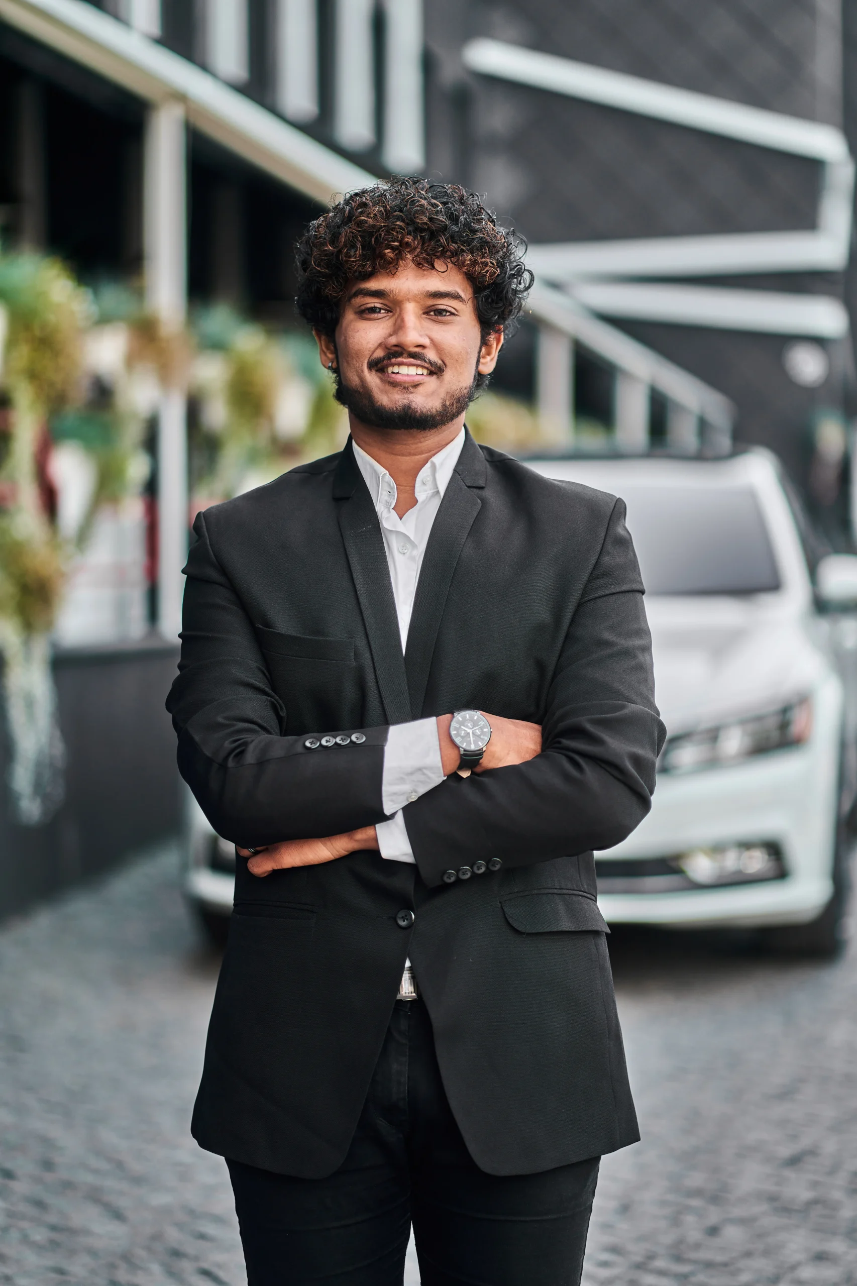 indian-businessman-with-his-white-car